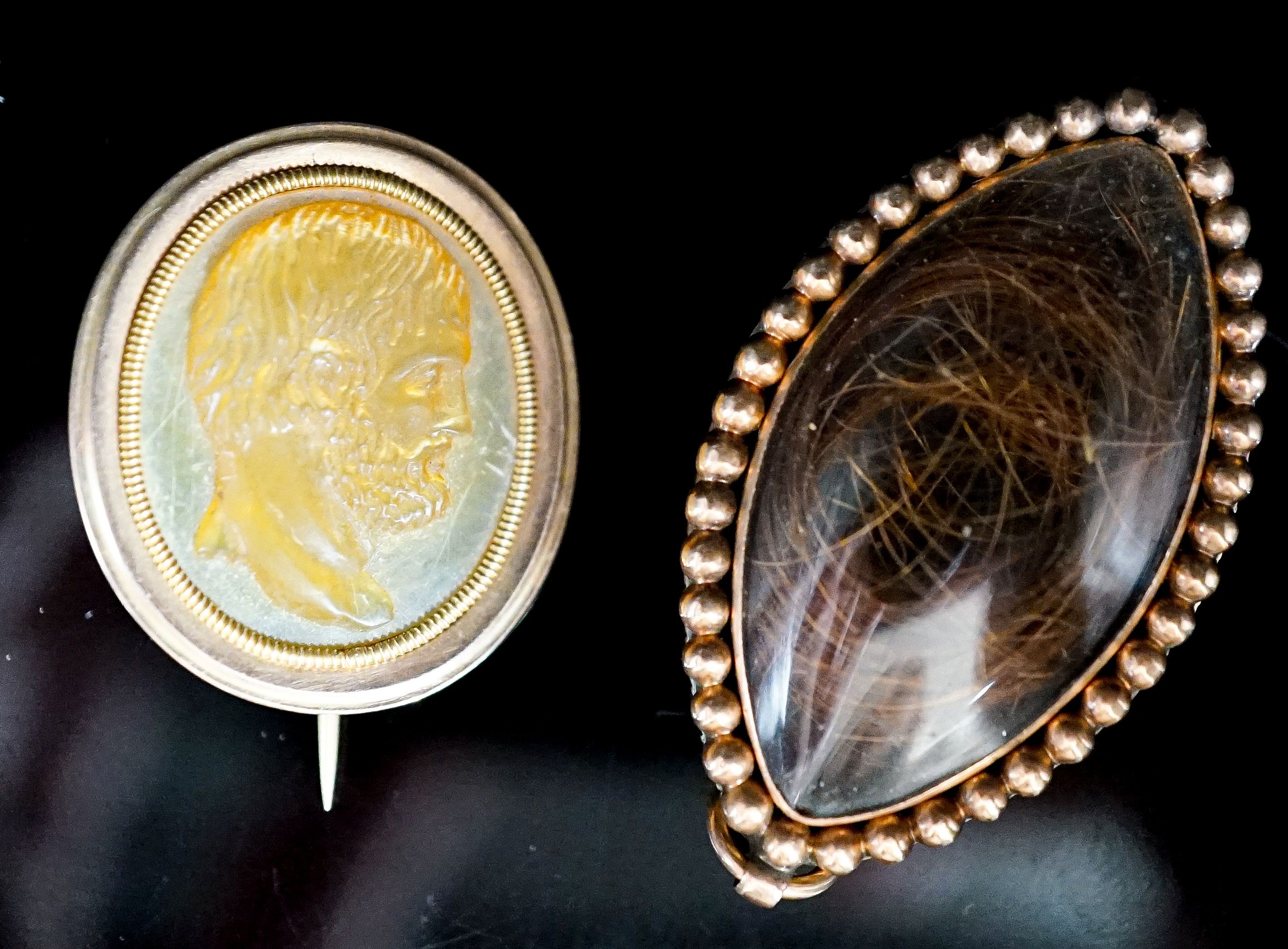 A Regency seed pearl set yellow metal locket and a mother of pearl cameo brooch